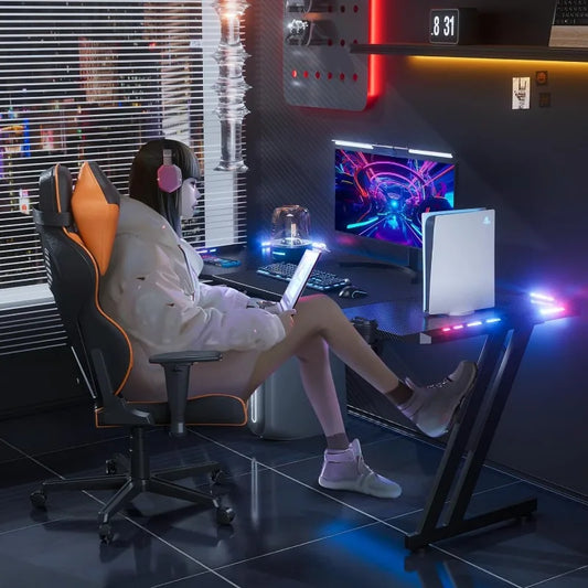 47-inch gaming desk with carbon fiber surface, RGB LED lights, headphone hook, cup holder, and oversized mouse pad for home office or gaming setup